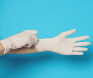 hands wearing surgical gloves, classification gloves costa rica